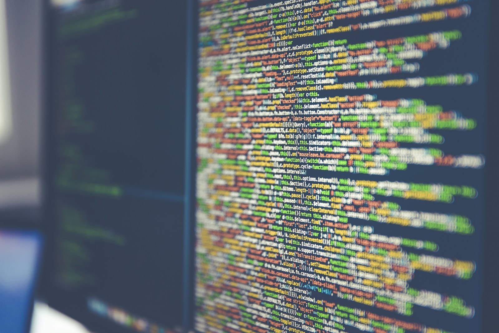 Colorful TypeScript source code on a computer monitor